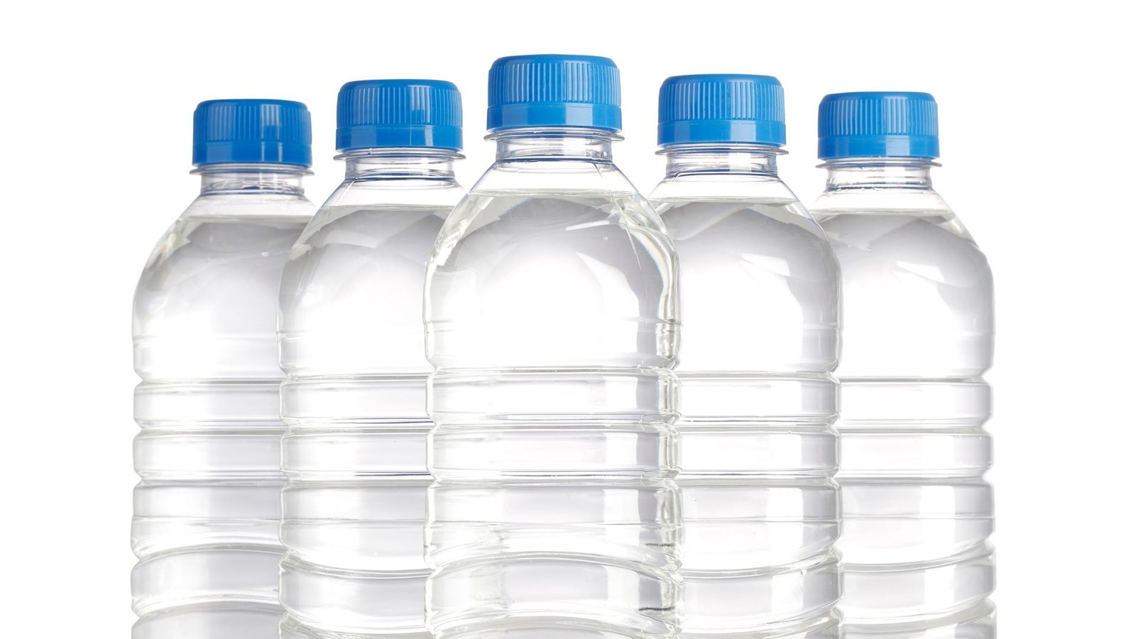 Filtered water plastic water bottles aligned in a row with blue caps against a white background.