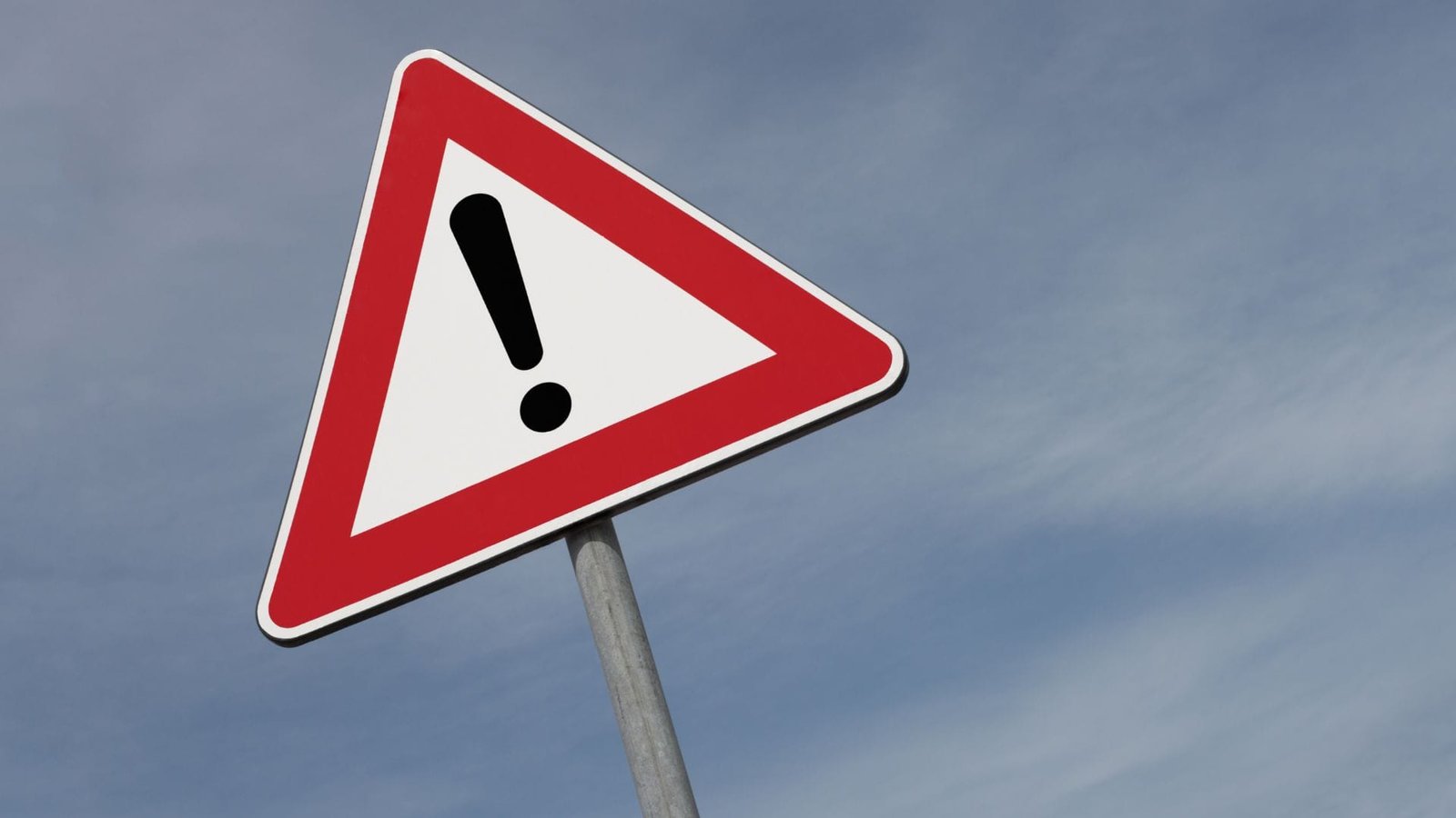 Water softener leaking warning road sign featuring triangular design with bold exclamation mark.