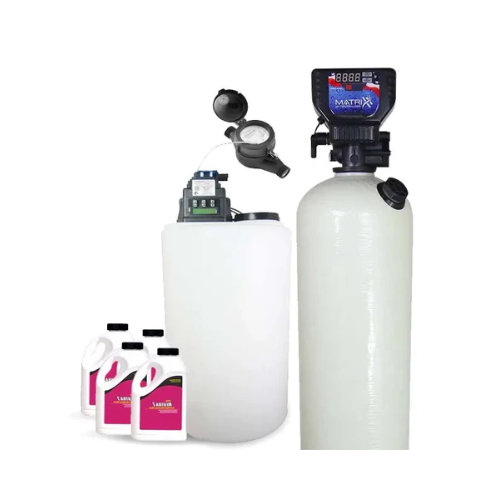 Acid neutralizer well water system with digital display, calcite tank, and Scale Ban products in view.