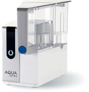 Best water filter AquaTru removing calcium and lime, featuring sleek design in modern kitchen setting.