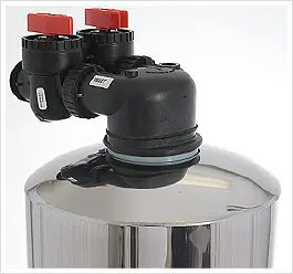 Bypass valve stainless steel tank featuring red control knobs and secure connection system, ideal for water management.