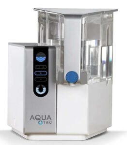 Reverse Osmosis Systems AquaTru Countertop water purifier featuring modern design, control panel, and transparent tank.