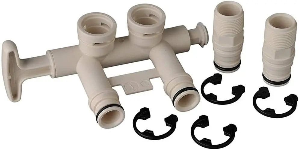 Water softener leaking bypass valve seal with plastic manifold system and secure connectors for plumbing.